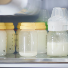 bottles of Breast Milk in fridge for Bridge Initiative