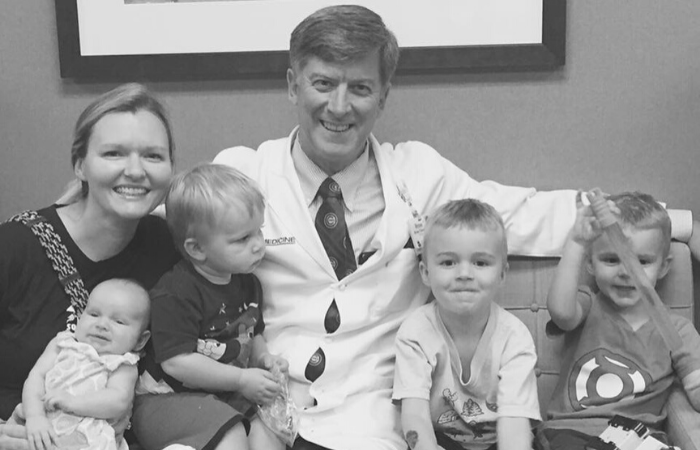 Robin Riddle with physician and four young children