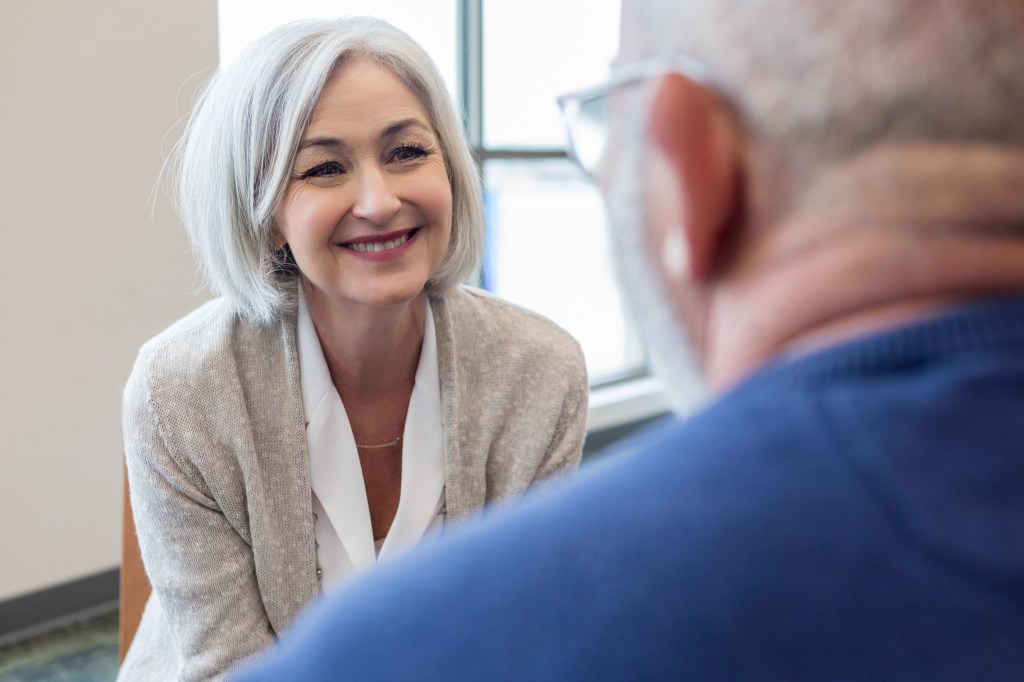 A wife smiles encouragingly at her husband after he shared painful emotions related to spiritual health