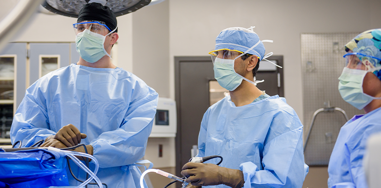UAB Medicine's Amit Momaya, M.D. performing orthopaedic surgery with colleagues
