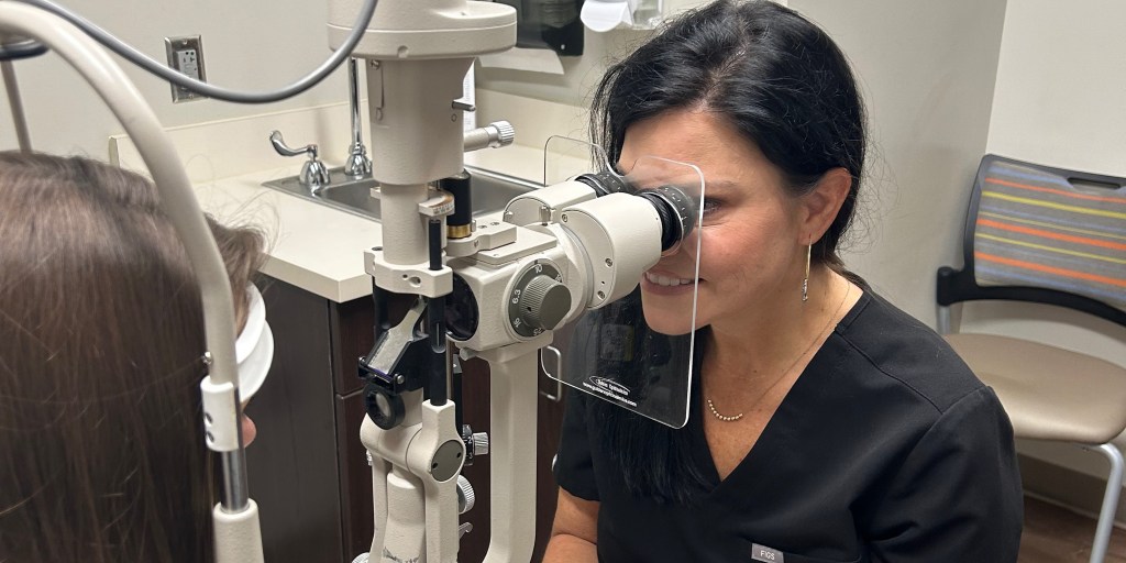 Female eye doctor conducting an eye exam
