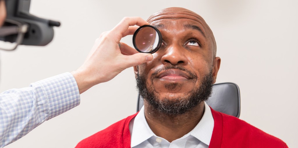 African American male patient receiving an eye exam