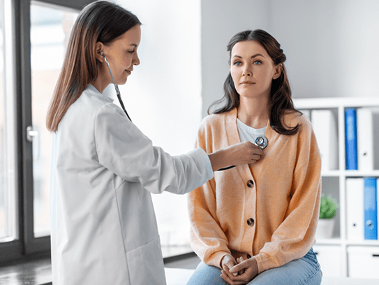 Woman doctor check a female patients heart health