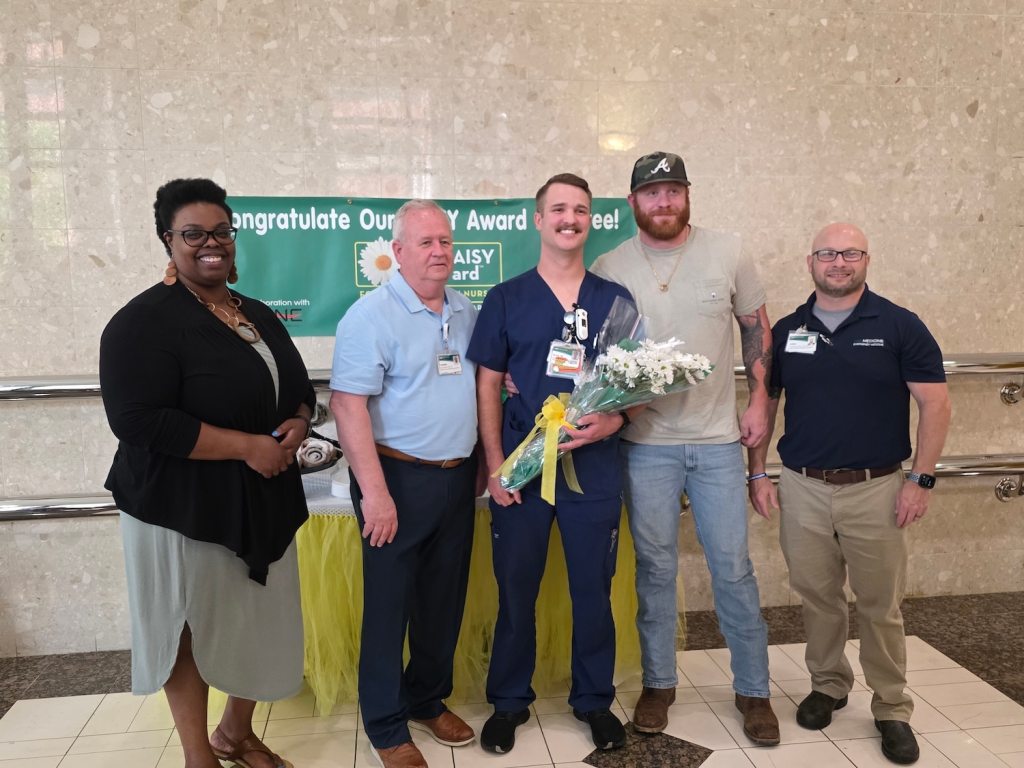 UAB Hospital employees posing for a photo