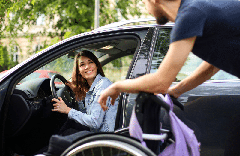Handicapped woman in driver seat of car