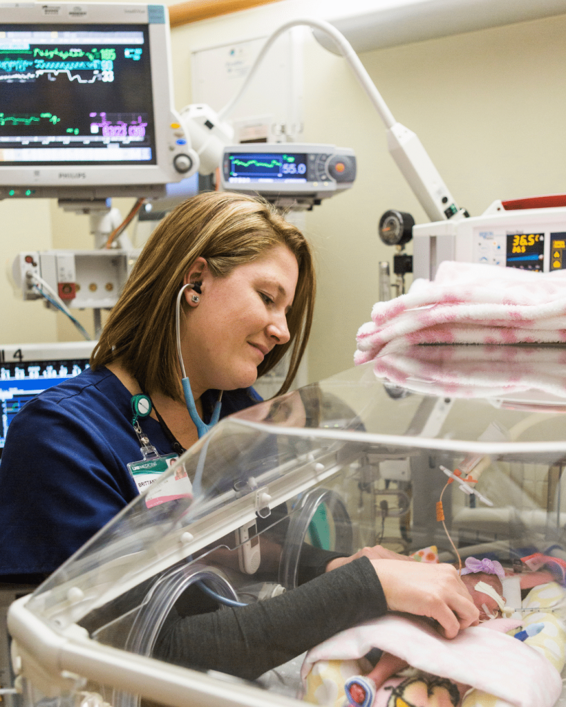 UAB Medicine nurse checking on a preemie