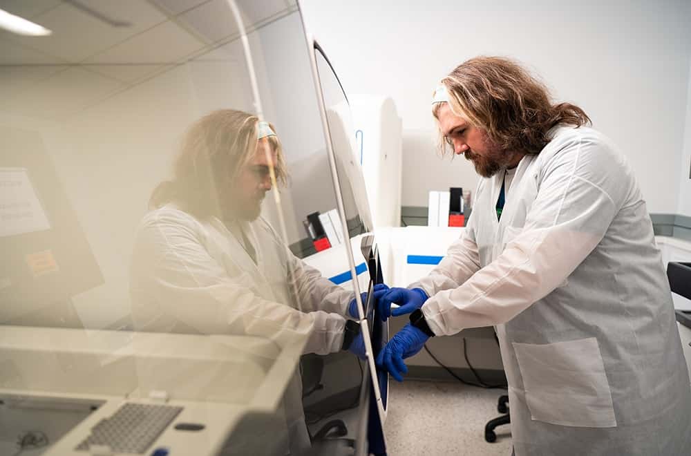 Medical Technologist Dennis Quertermous, MLS (ASCP) runs a test on one of UAB's advanced gene sequencing machines.