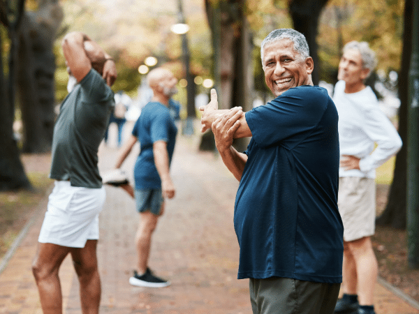 group of older men exercising in a park