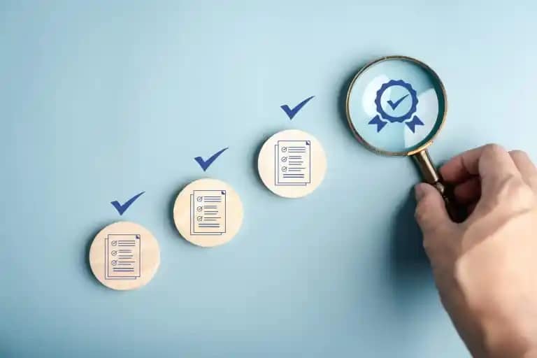 magnifying glass over a checklist