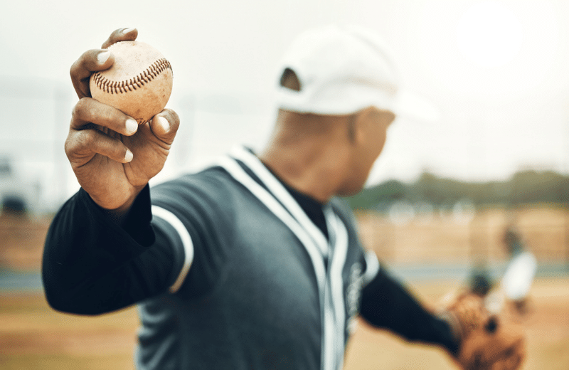 baseball player throwing a pitch