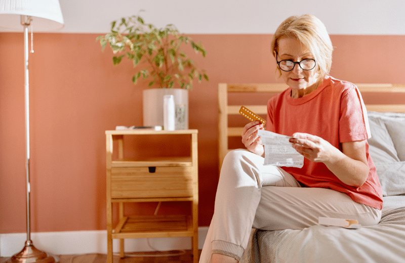 older women reading a medication pamphlet